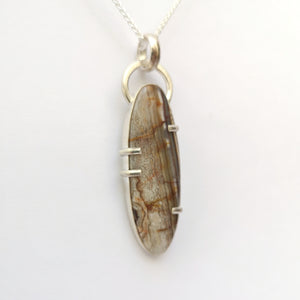 Grey Agate silver pendant with leaf details on the back.