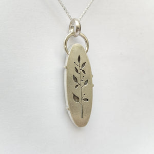 Grey Agate silver pendant with leaf details on the back.